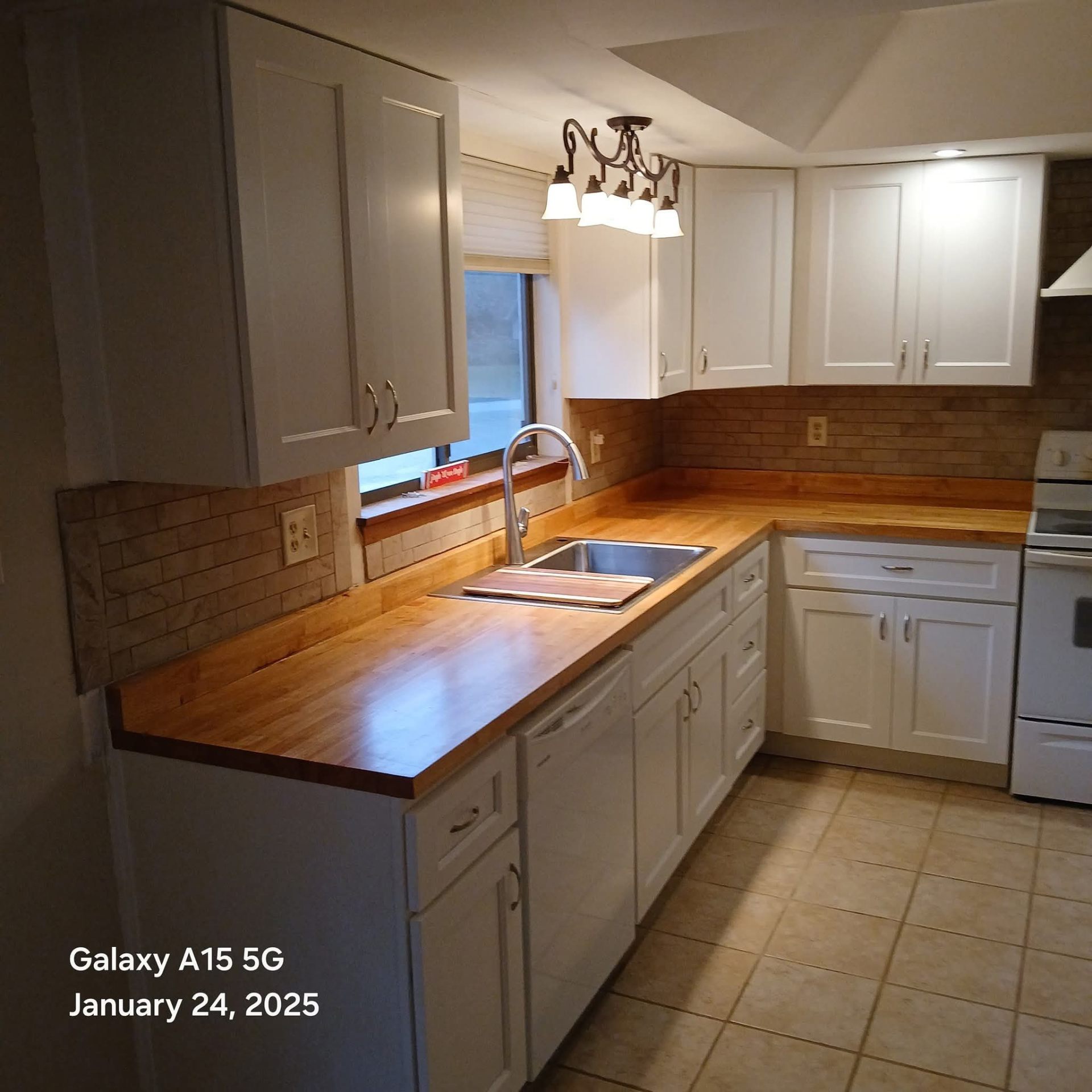 Complete kitchen renovation with custom cabinetry and butcher block countertops